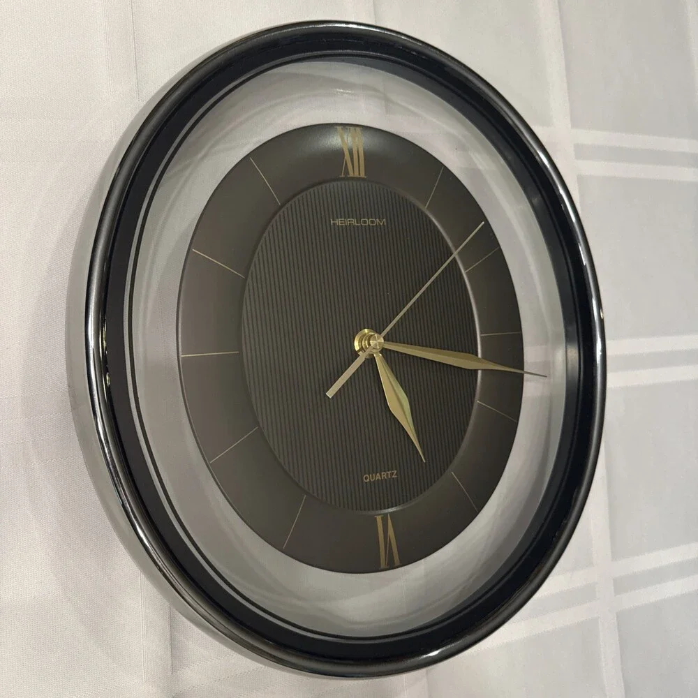 Vintage 1980s Heirloom Quartz Wall Clock Clear Lucite Floating Oval Black Gold